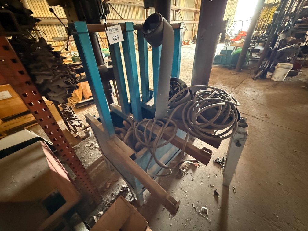 Industrial Blue Steel Storage Rack with Assorted Hoses and Belting