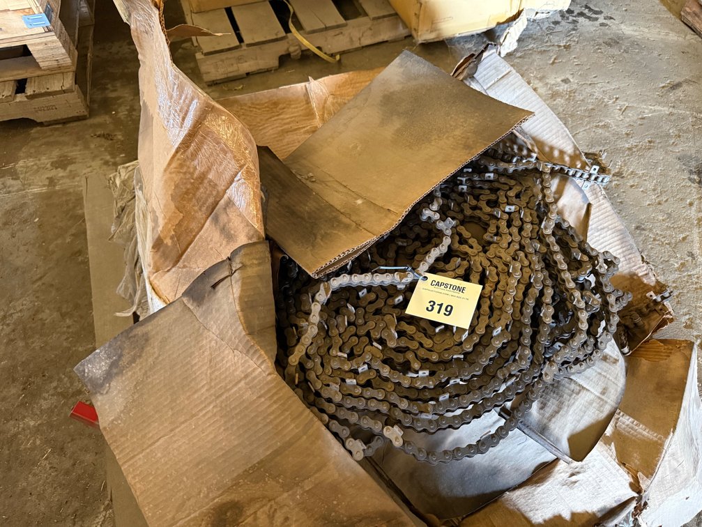 Heavy Industrial Roller Chain with Attachments on Wooden Pallet