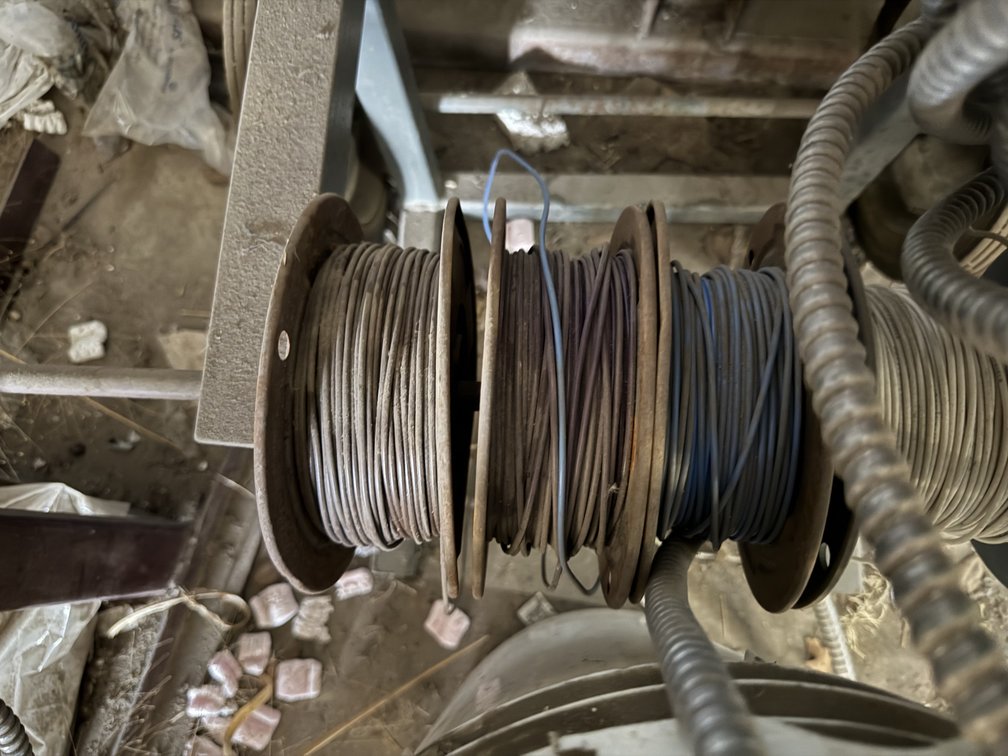 Metal Wire Spool Rack with Electrical Conduit and Wiring