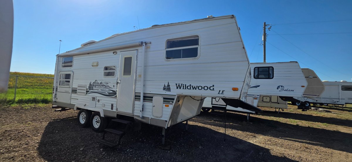 2004 Wildwood LE 24bhss, 16 ft awning, 12-ft slide, tires Fair, interior not bad, bunkhouse-water damage in the corner of the bunkhouse, rear bathroom, front's not bad could be fixed up. 2-30 lb LP tanks