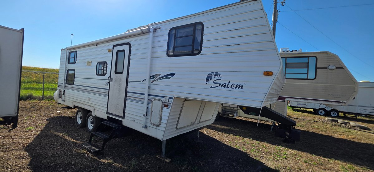 1999 Salem by Forest River, 12-ft awning, 6 ft slide, bunkhouse, tires Fair, water damage in upper bedroom, roof falling in-needs work, 2- 20 lb LP tanks, gooseneck ball hitch