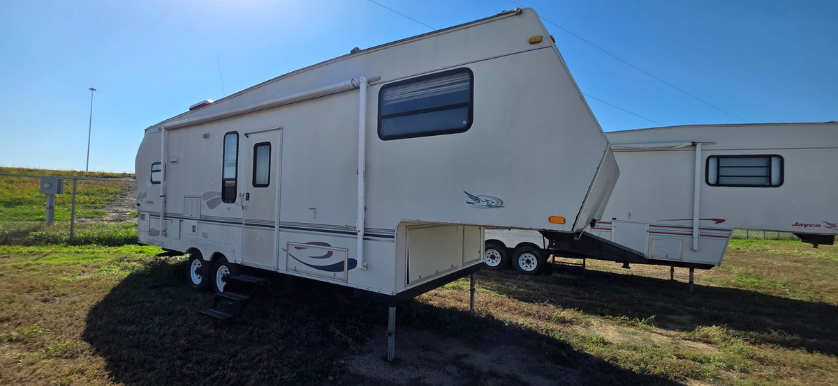 2001 Eagle by Jayco 263, 16 ft awning, 2-30 pound LP tanks, 14' slide, tires fair, interior needs work especially in the back, camper needs work, front end damage above bed