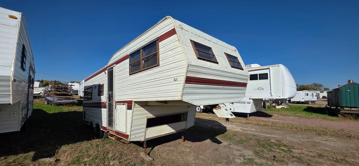 1983 New Way camper, hail damage, this camper is to be used as a trailer, tires are flat, lots of damage inside and out, probably best to be classified as a future trailer