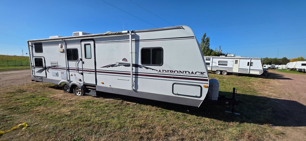 2005 Adirondack bumper hitch trailer, 12 ft slide, 22 ft awning, bunkhouse, rear bathroom, front bathroom, needs tires, floors a little soft, need some work, could be made into another camper, 2-30 LP tanks  - No Title (Parts)