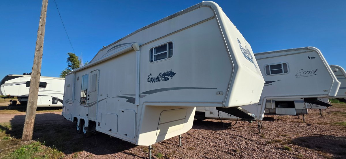 1998 Excel 30-5 fifth wheel camper, tires are good, awning, 50 amp plug, two slides, this camper is going to need some work lots of TLC, smells, needs work