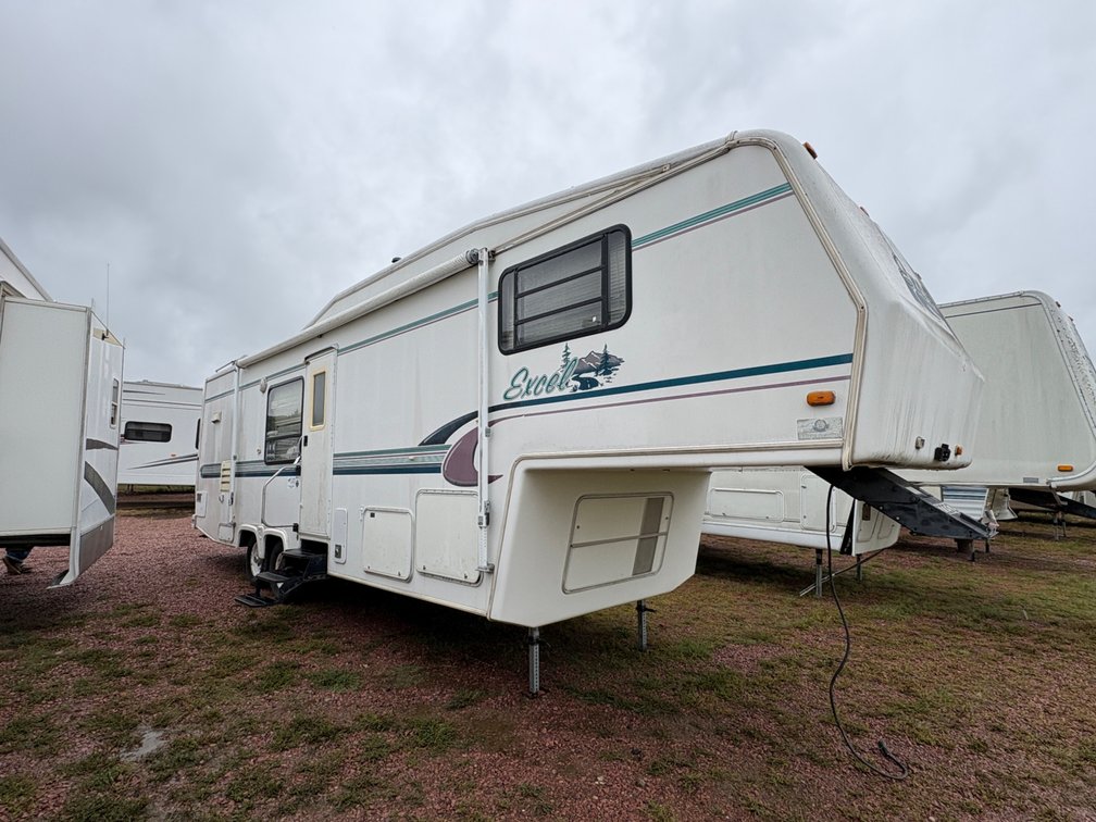 1996 Excel 30-15, 16' Awning, Reciver Hitch on Back, 2-30lb LP Tanks, 12' Slide, Useable Fixer Upper, Fair Tires