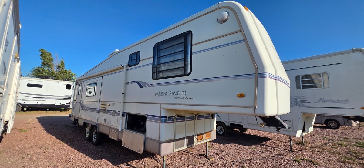 1997 Holiday rambler aluma lite custom 32,  with 18 ft awning, 7' and 14' slide. Tires good, inside very decent, very usable camper with a little TLC and just some minor tweaks, everything appears okay