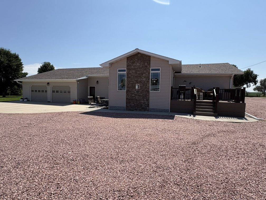 12.5 acre acreage with: 2390 sq. ft. 4 bedroom 3 bath ranch style home