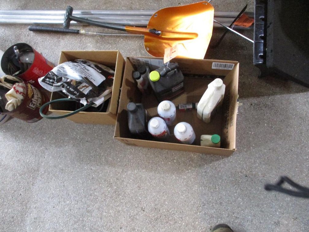 (1) Box of Sprays, (1) Box of Mower Parts