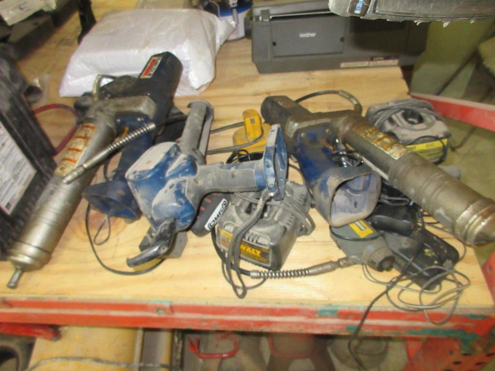 (2) Lincoln Battery Powered Grease Guns, Assorted Battery Chargers, Jump Packs and More