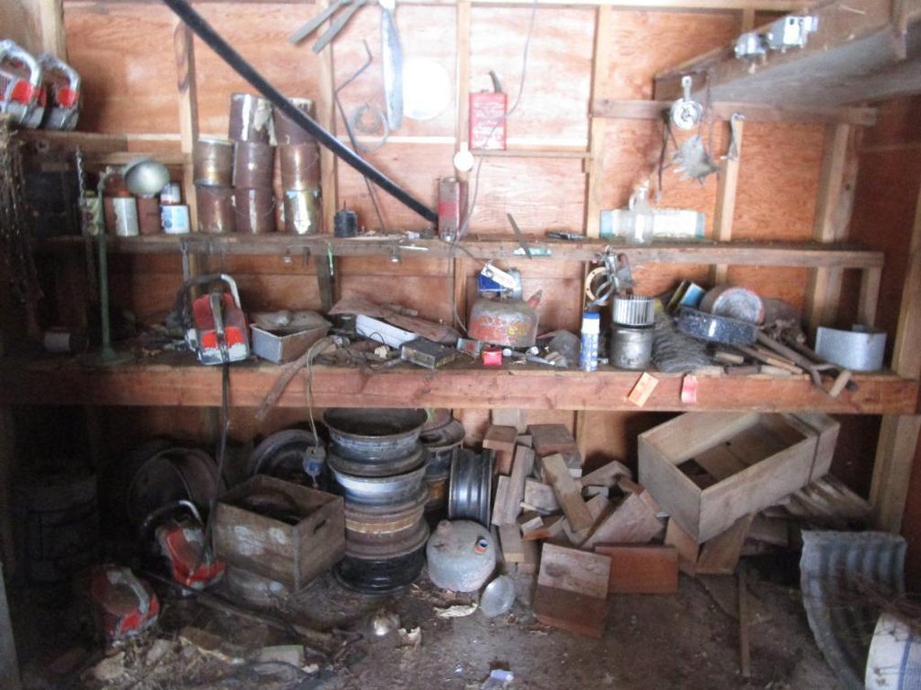 Contents of Back Wall and Shelf, Includes Gas Cans, Wire, Chain Saws, Electrical Boxes and More