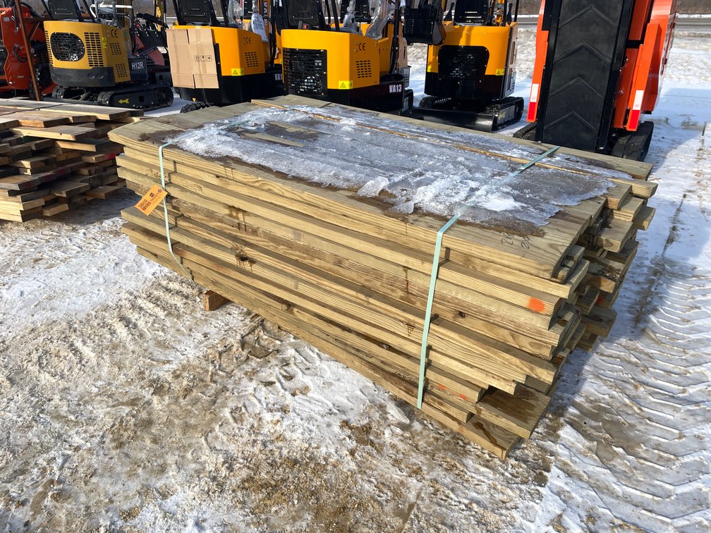 Bundle of Green Treated Lumber