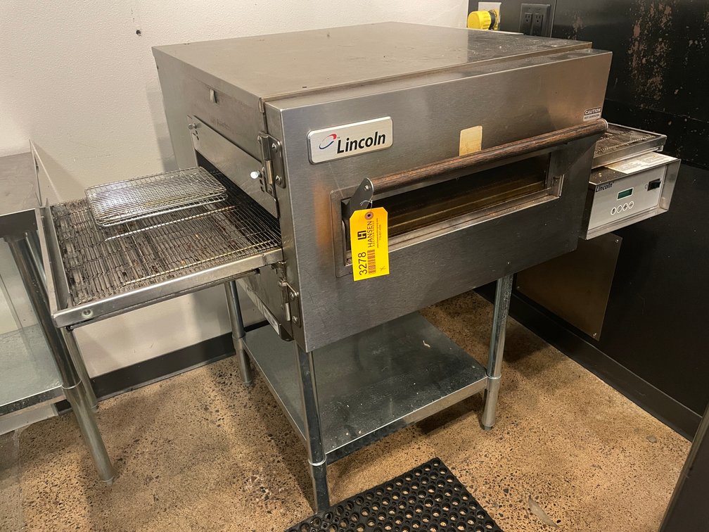 Lincoln Tabletop Conveyor Pizza Oven on Stainless Steel Table