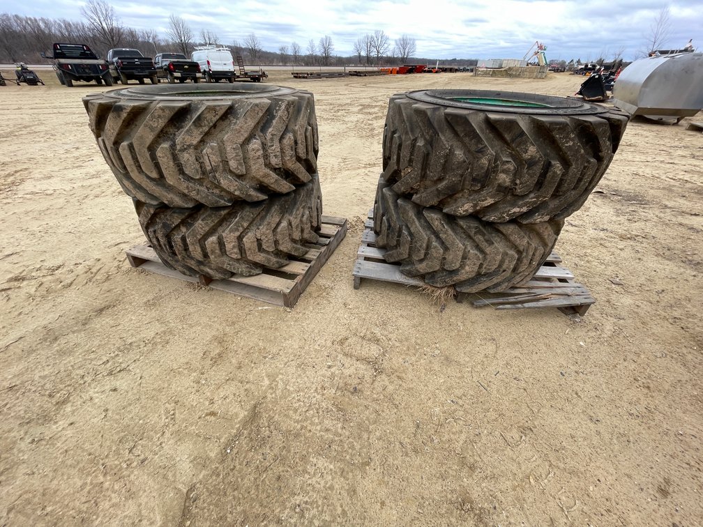 Set of (4) Outrigger Brand Boom Lift Tires on Rims