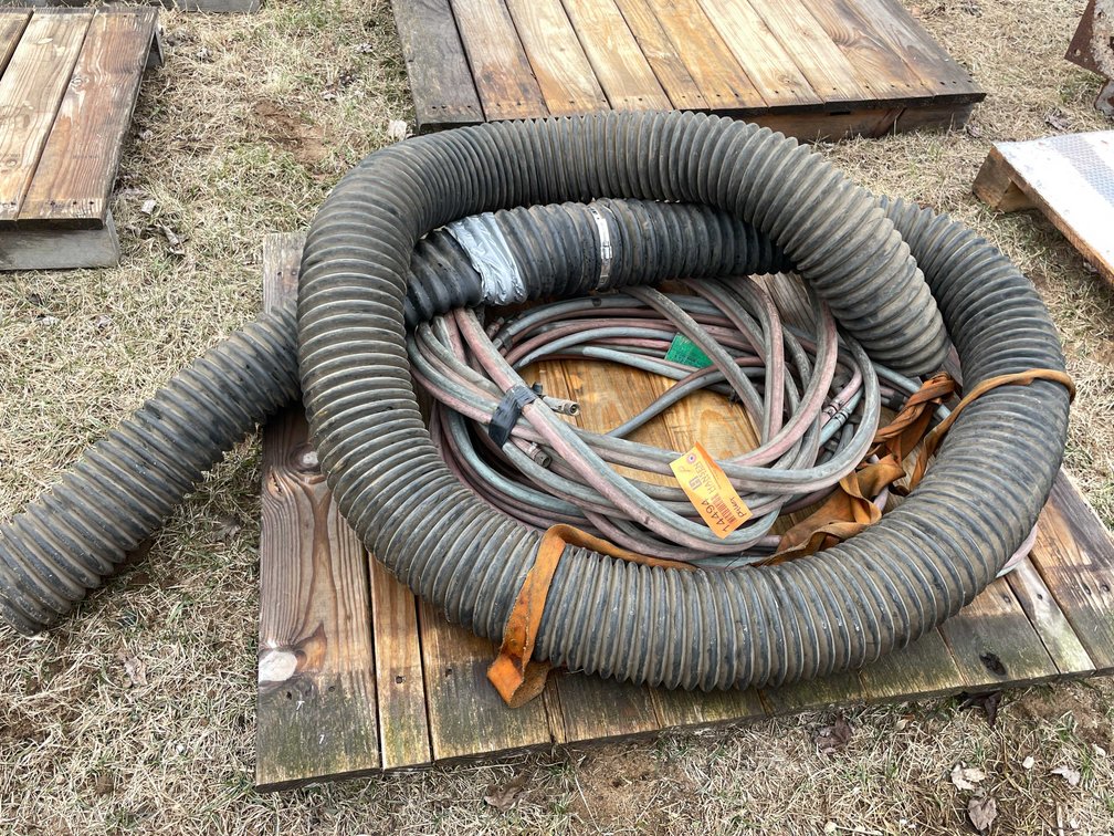 Pallet with Large Rubber Drainage Hose