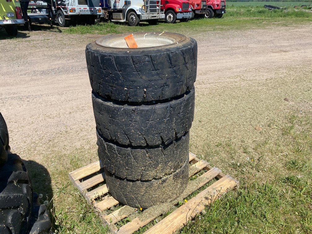 (4) 12-16.5 Skid Steer Tires on Rims (Deerbrook, WI)