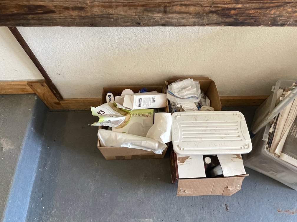 Various Content Hanging on Wall and On Floor