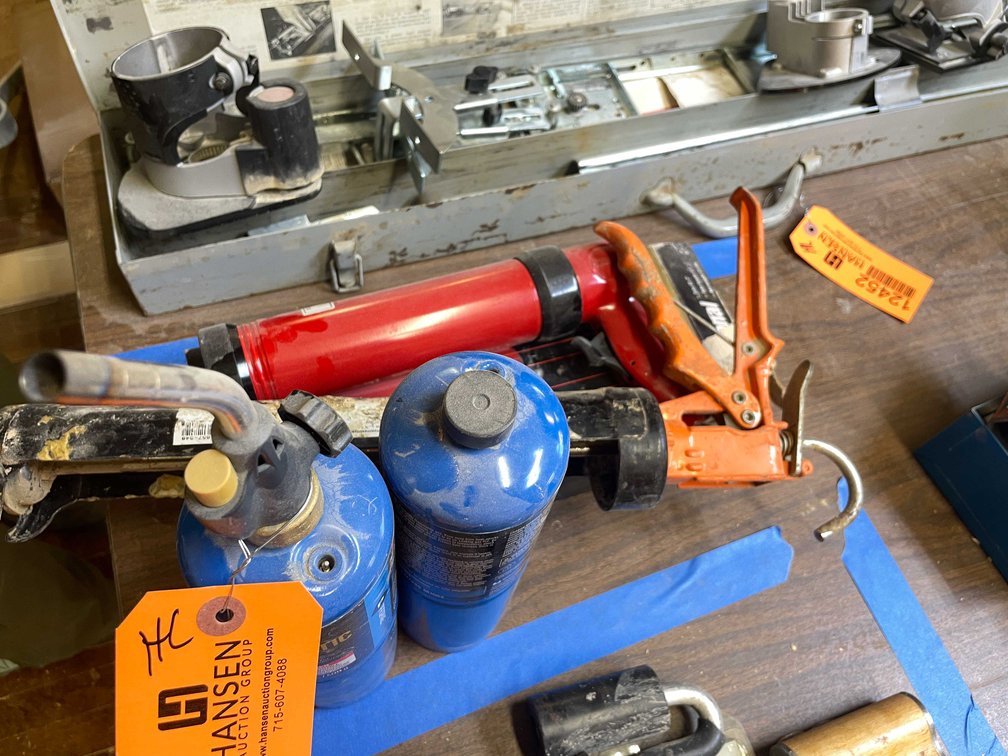 (2) Caulk Guns and (2) Propane Tanks