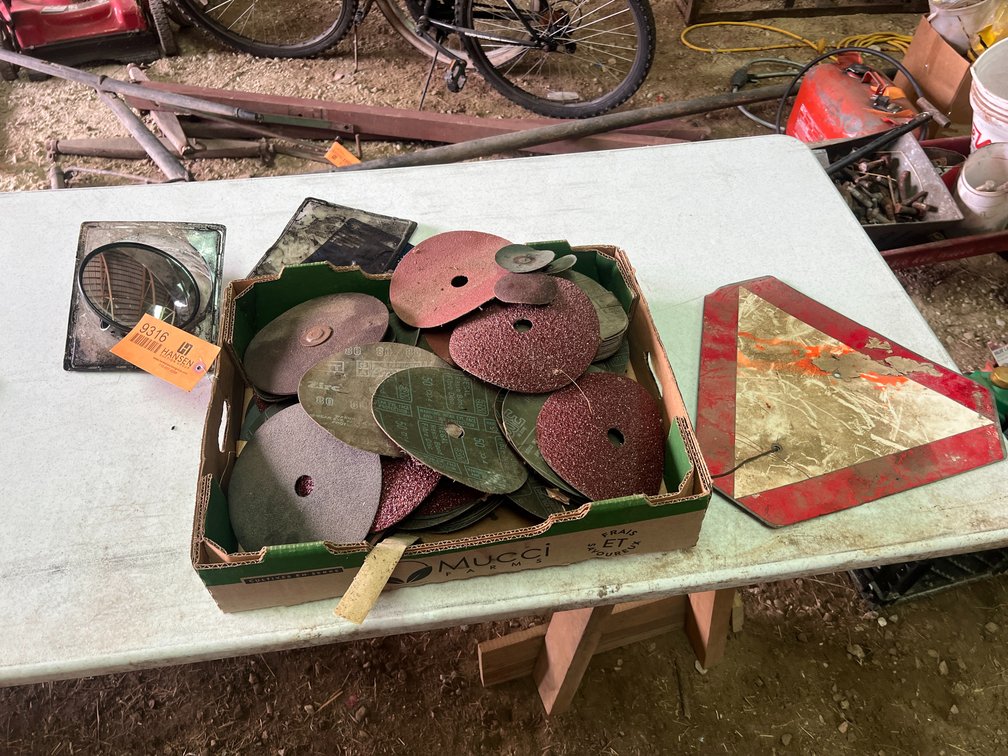 Mirror, Slow Moving Vehicle Sign, and Box of Disc Sandpaper