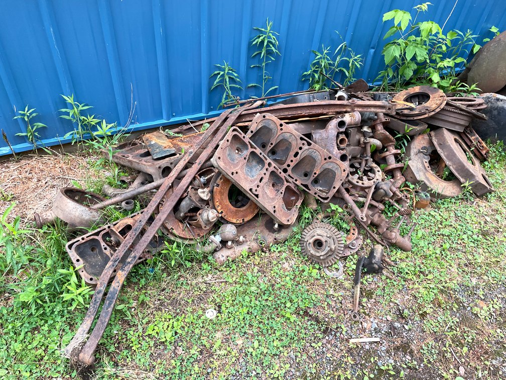 Pile of Clutch Discs and Plates and Engine Heads