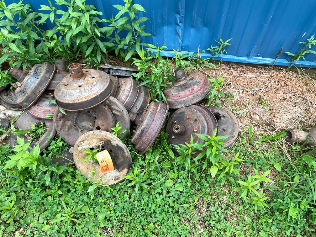 Pile of Model A Brake Drums and Vacuum Plates