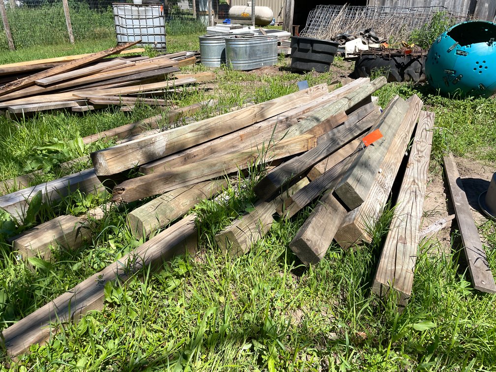 Pile of Used Wooden Posts