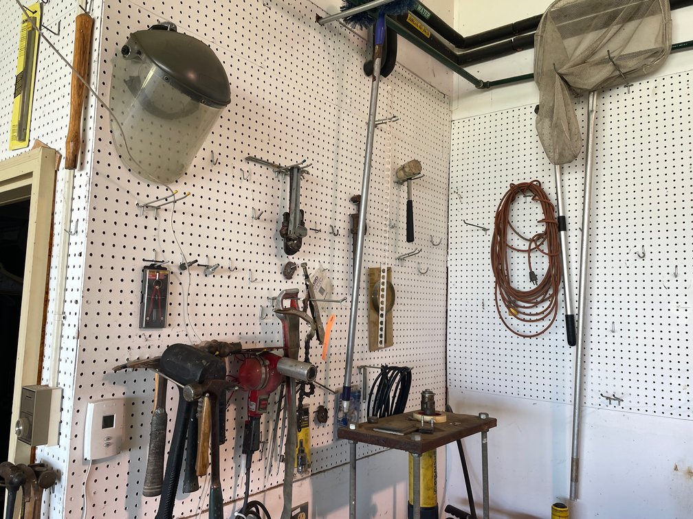 Tools Hanging on Peg Board