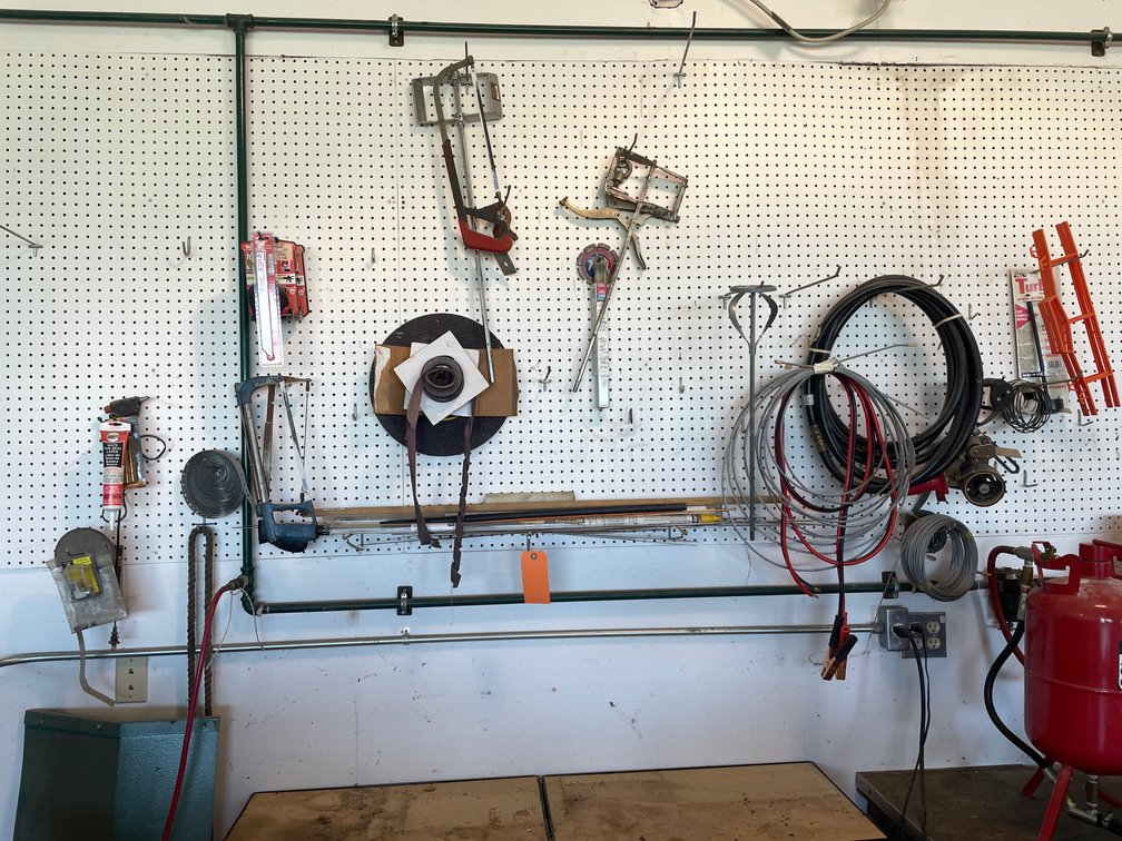 All Tools and Shop Supplies Hanging on Peg Board