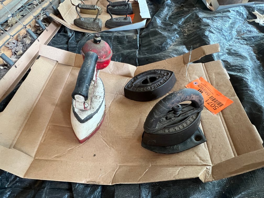 (3) Antique Sad Irons and (1) Trivet