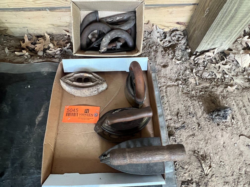 (4) Antique Cast Sad Irons and Box of Misc. Handles