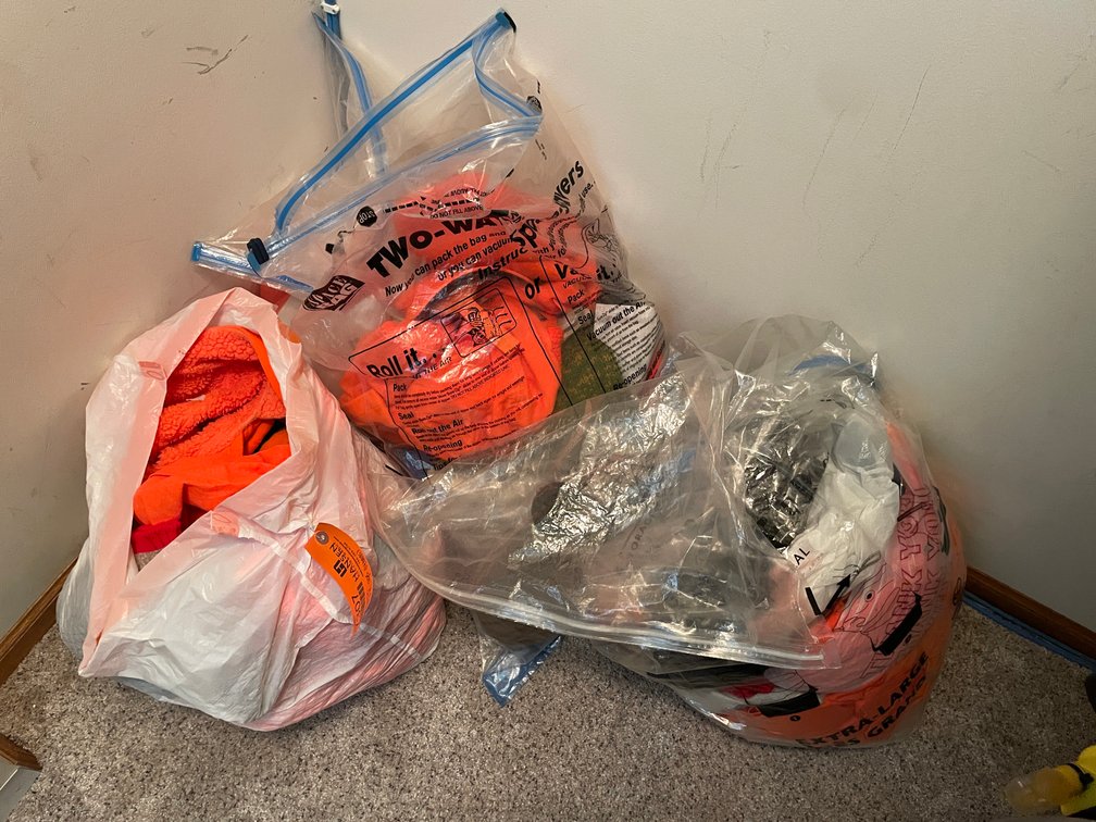 (4) Bags of Hunting Clothing