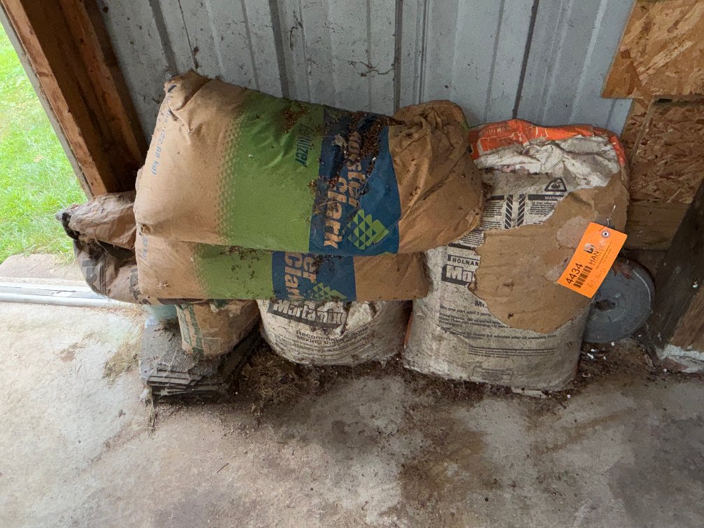 Bags of Cement, Fertilizer, and Rock