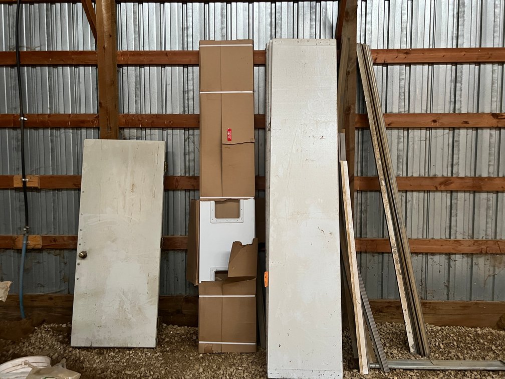 (5) Insulated 10' Garage Door Panels, Parts of Track, and Steel Service Door Panel