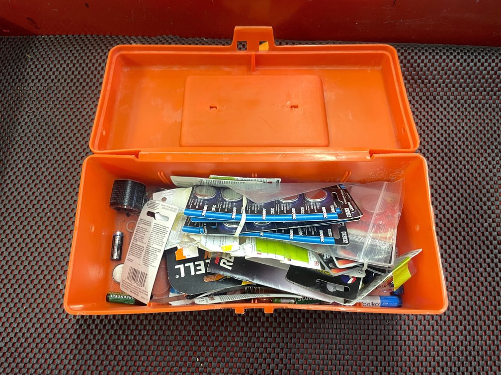 Plastic Toolbox with Various Batteries