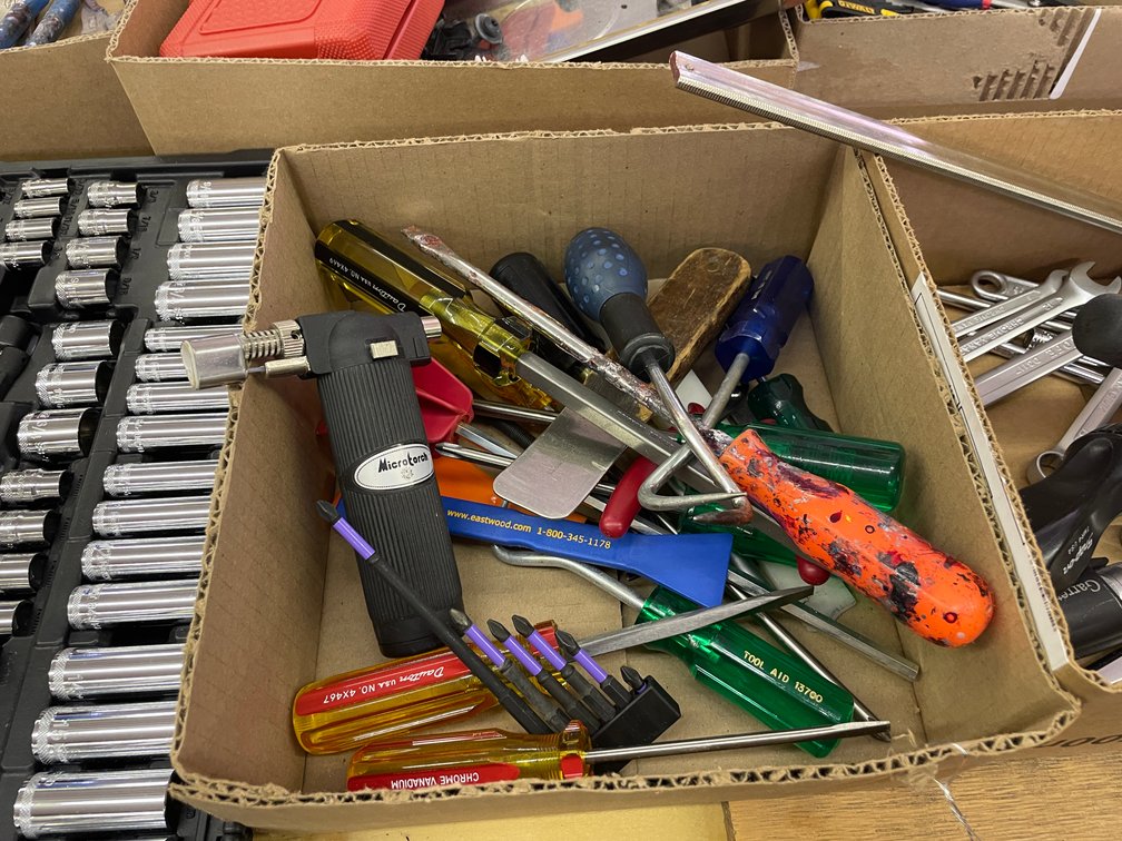 Box of Screwdrivers, Micro Torch, and Phillips Bits
