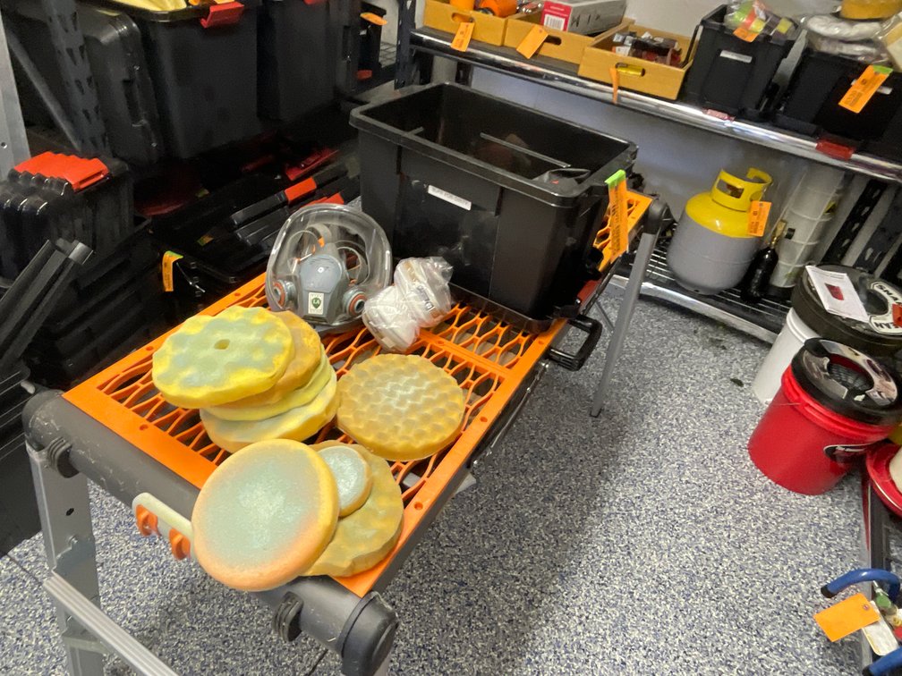 Tote of Used Buffing Pads