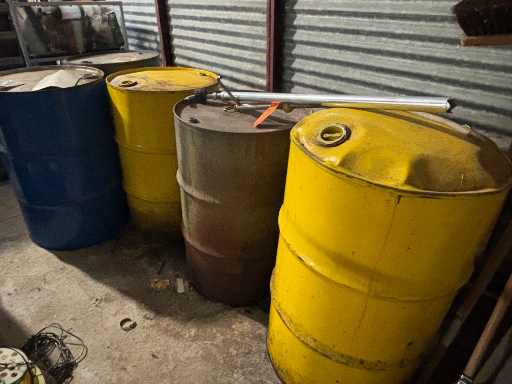 (5) Metal Barrels and (2) Pumps