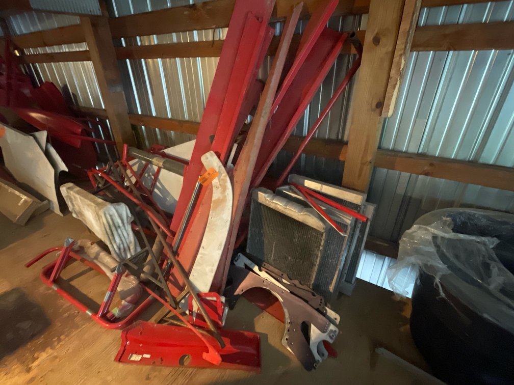 Race Car Parts Including Aluminum Radiators, Tubular Frame Components, Body Panels, and More