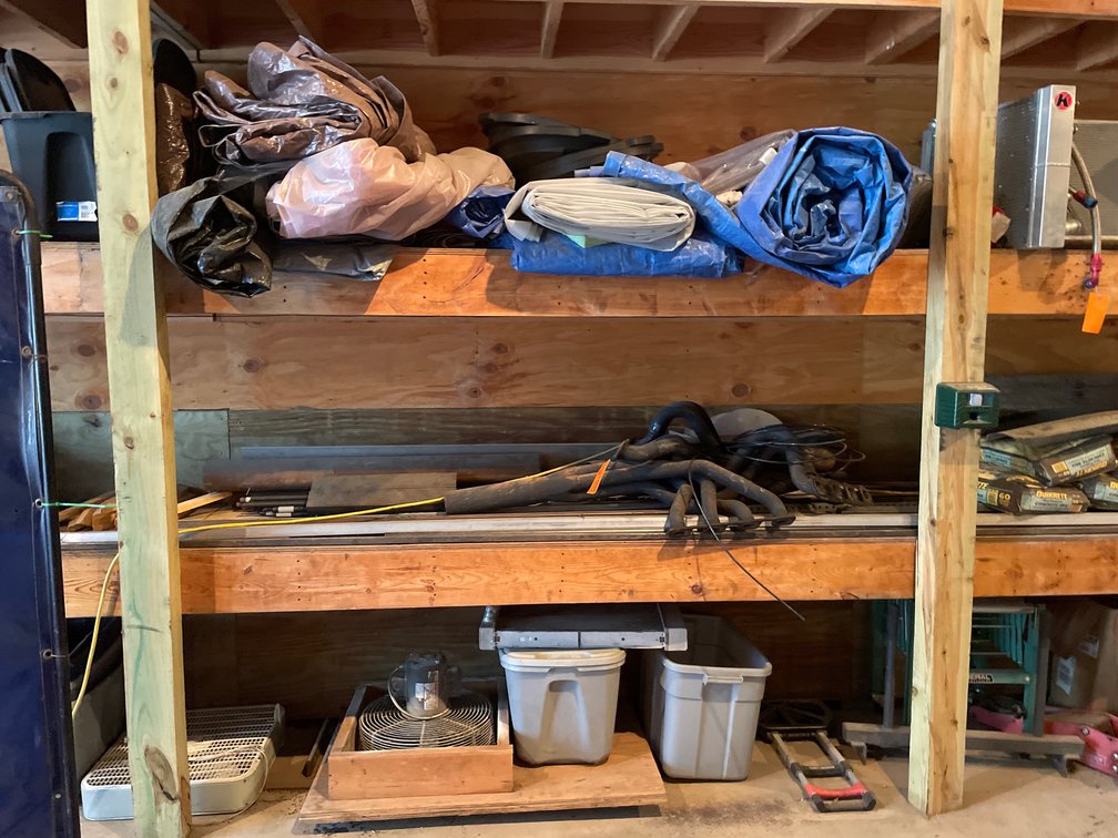 Shelf Contents with Exhaust Headers, Tarps, Plastic Totes, Hand Truck, and More
