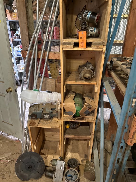 Wooden Cubby Shelf with Starter Motors, Hydraulic Pump, Fuel System Components, and More