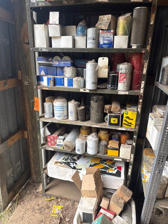 Metal Shelving Unit with Heavy Equipment Filters, Replacement Parts, and More