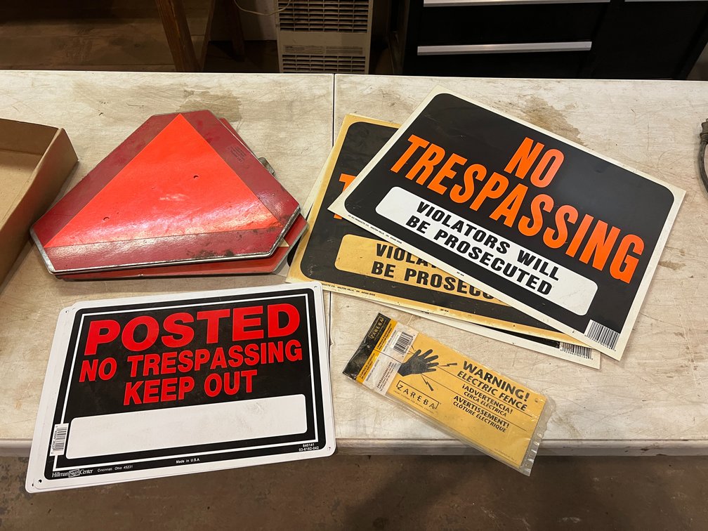 Slow Moving Vehicle Signs and No Trespassing Signs