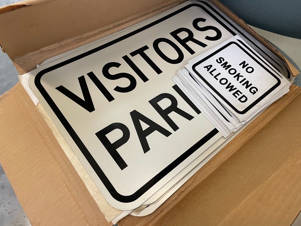 No Smoking Stickers with Visitor Parking Signs