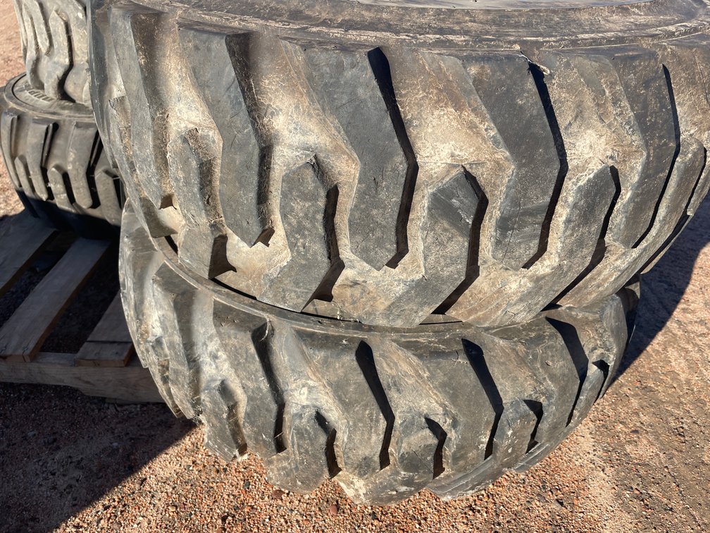 Set of (4) Skid Steer Tires On Steel Rims