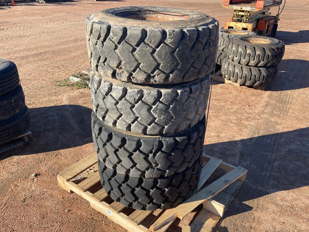 Set of (4) Skid Steer Tires On Steel Rims