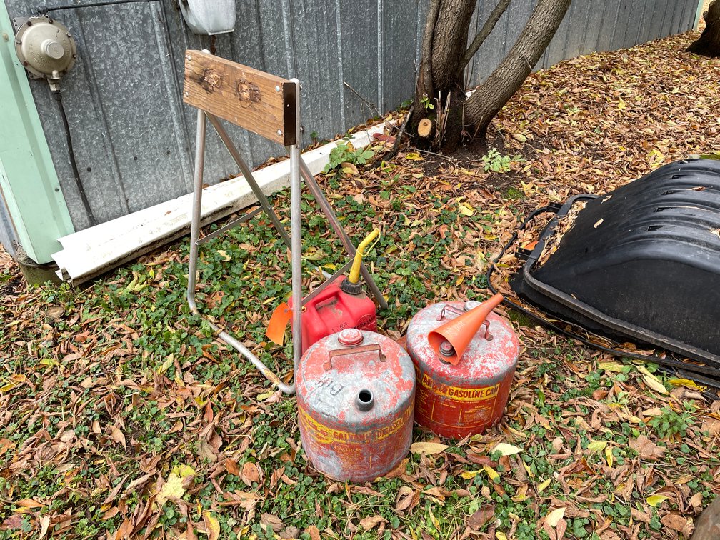 Boat Motor Stand and (3) Gas Cans