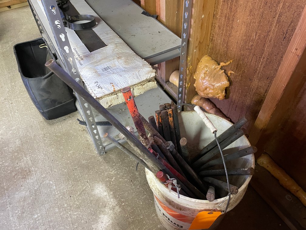 Bucket of Concrete Stakes