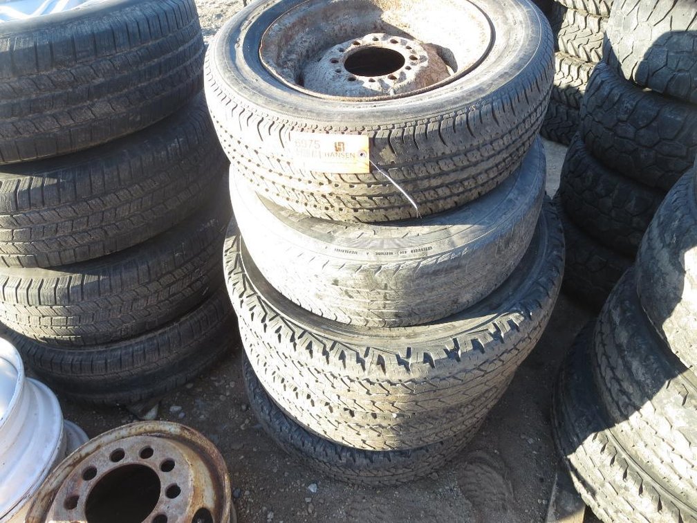 Stack of Tires, Includes 215/65R 15 Tire and Rim, 215/70R15 Tire and Rim and (3) 215/70R17 Tire