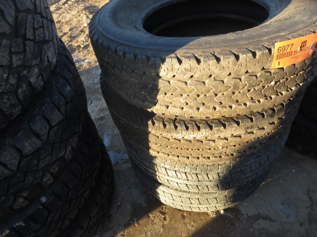 (2) Firestone TransForce LT235/80R17 and (2) Long March 235/85R16
