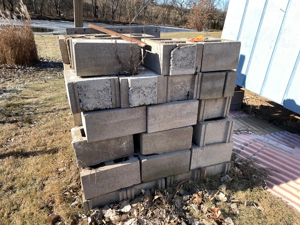 (2) Piles of Concrete Blocks